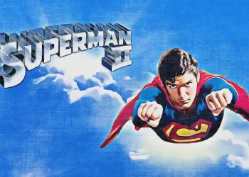 Superhero flying over cityscape at night