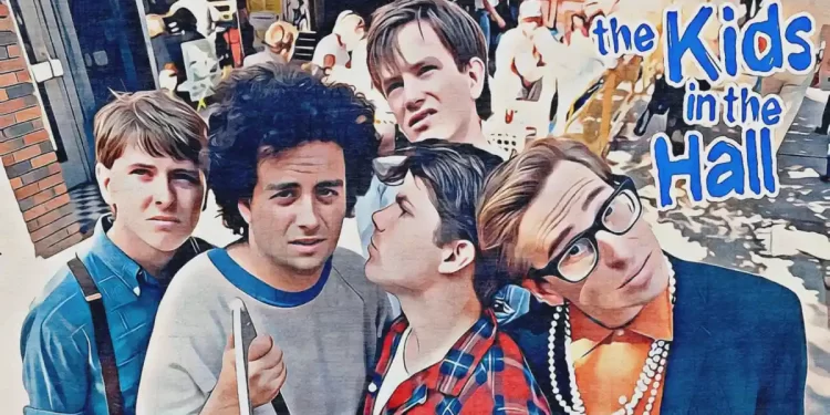 Comedy group posing outdoors with logo.