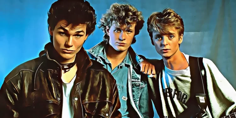 A-ha band members Morten Harket, Magne Furuholmen, and Paul Waaktaar-Savoy posing together in an 80s-style portrait.