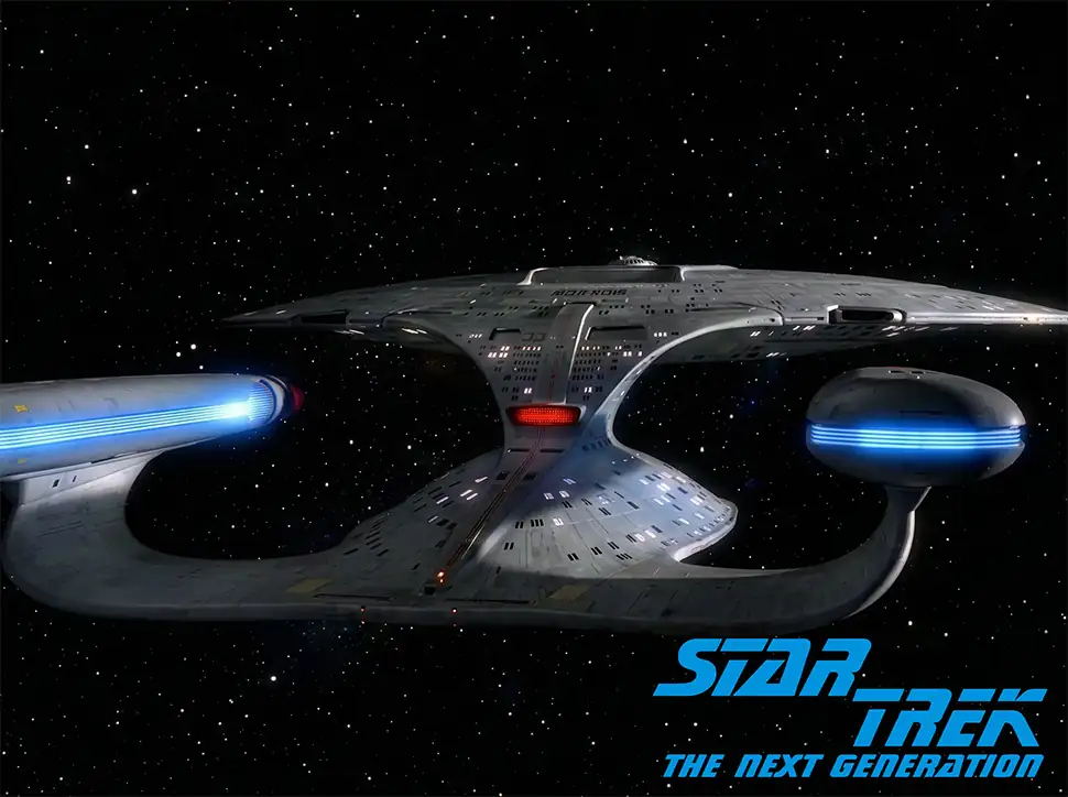 USS Enterprise-D starship from Star Trek The Next Generation flying through space with stars in the background.